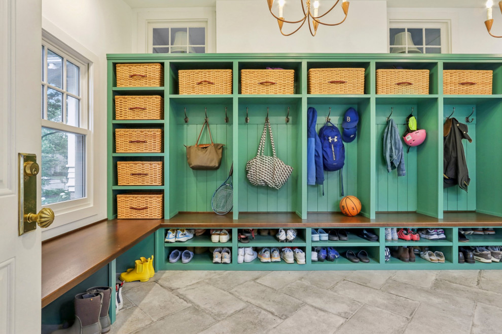 Mudroom - large transitional limestone floor and gray floor mudroom idea in Milwaukee with white walls and a white front door