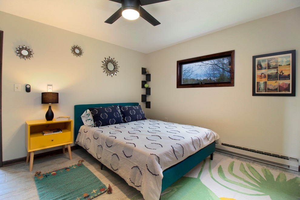 This is an example of a small modern master bedroom in Other with white walls, vinyl floors and grey floor.