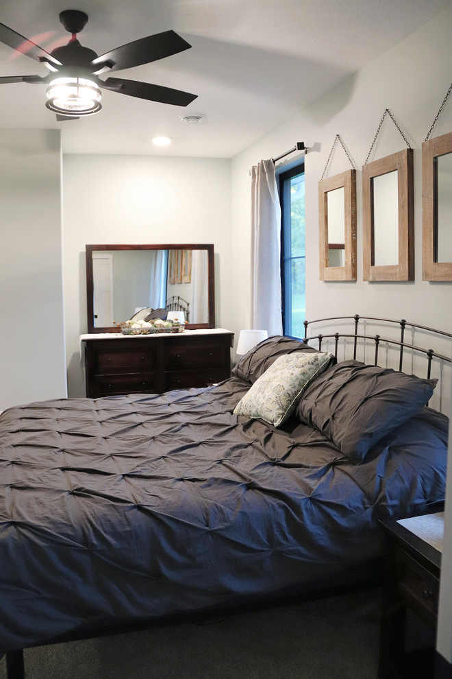 Design ideas for a large transitional master bedroom in Other with grey walls and grey floor.