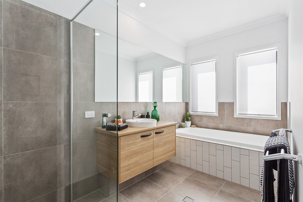 Design ideas for a contemporary bathroom in Brisbane with flat-panel cabinets, light wood cabinets, a drop-in tub, a curbless shower, white walls, a vessel sink, wood benchtops, brown floor and an open shower.