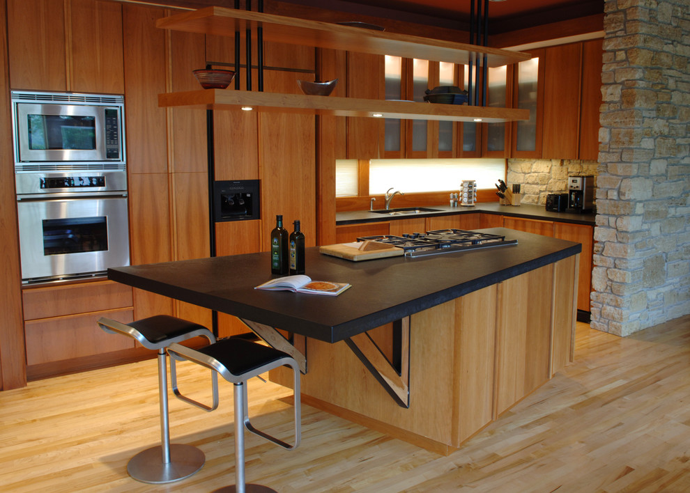 This is an example of a contemporary kitchen in Minneapolis with stainless steel appliances.