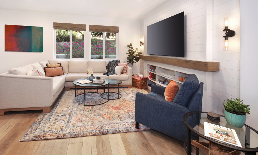 Photo of a small modern open concept family room in Orange County with white walls, vinyl floors, no fireplace, a wall-mounted tv, brown floor and planked wall panelling.