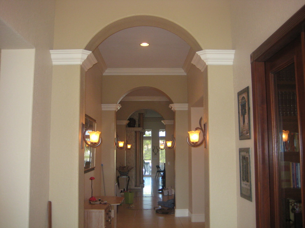 Entry hall photo in Miami with beige walls