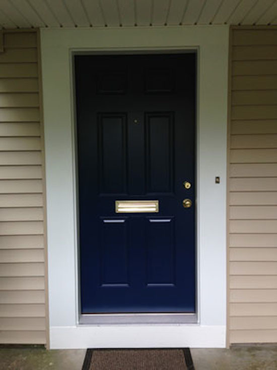 Example of a small front door design with a blue front door