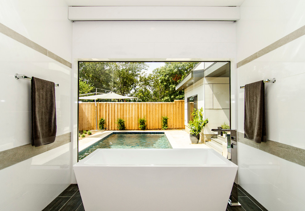 Design ideas for a contemporary bathroom in Dallas with a freestanding tub.