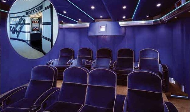 Design ideas for a small contemporary open concept home theatre in Tampa with blue walls, carpet and a wall-mounted tv.