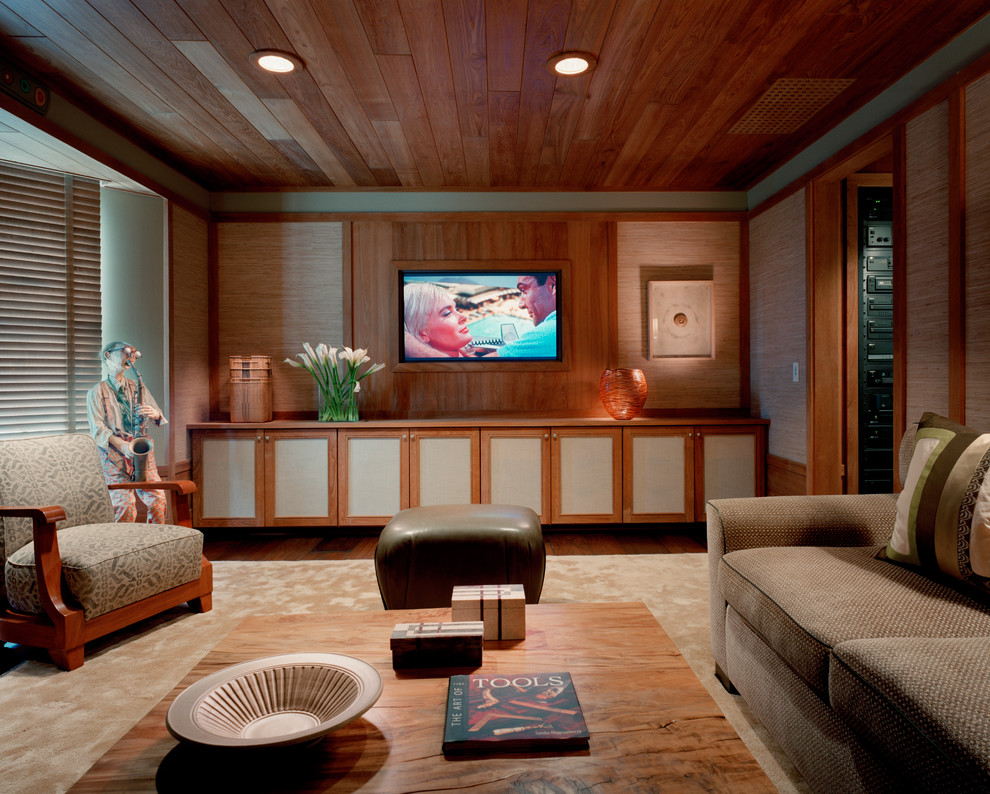 Contemporary home theatre in New York with a wall-mounted tv.