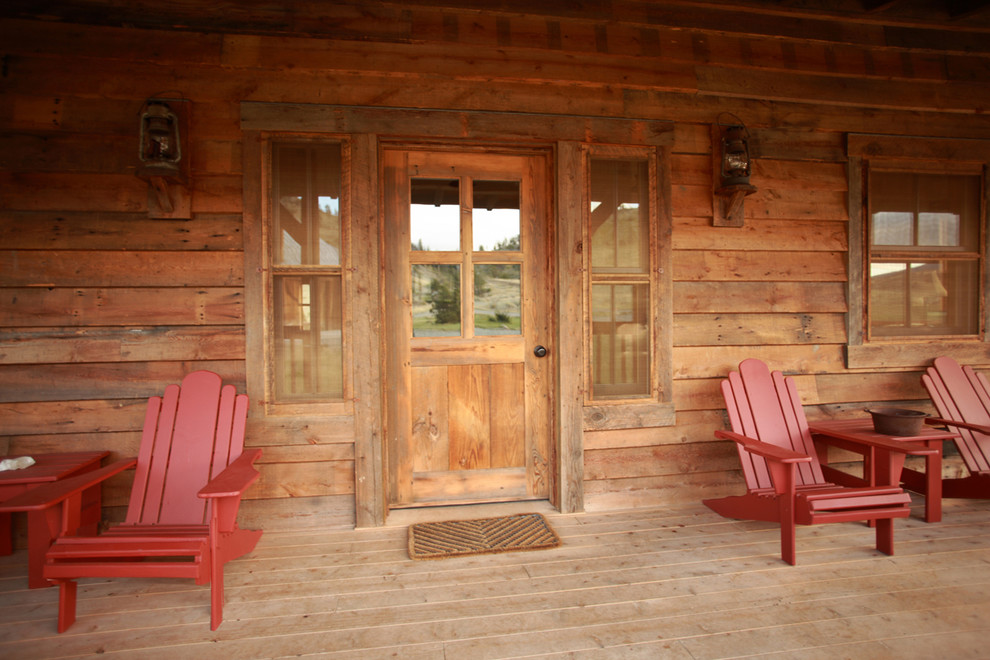 Country entryway in Other with a single front door and a medium wood front door.