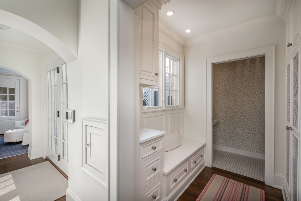 Inspiration for a small transitional medium tone wood floor and brown floor vestibule remodel in Milwaukee with white walls and a white front door