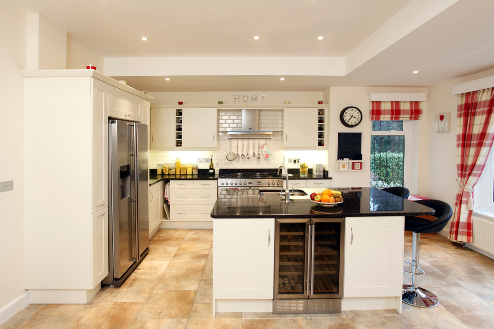 Design ideas for a traditional kitchen in West Midlands with subway tile splashback.