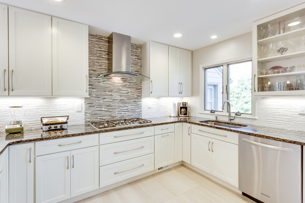 Photo of a large transitional u-shaped kitchen in DC Metro with an undermount sink, shaker cabinets, white cabinets, quartz benchtops, stainless steel appliances and a peninsula.