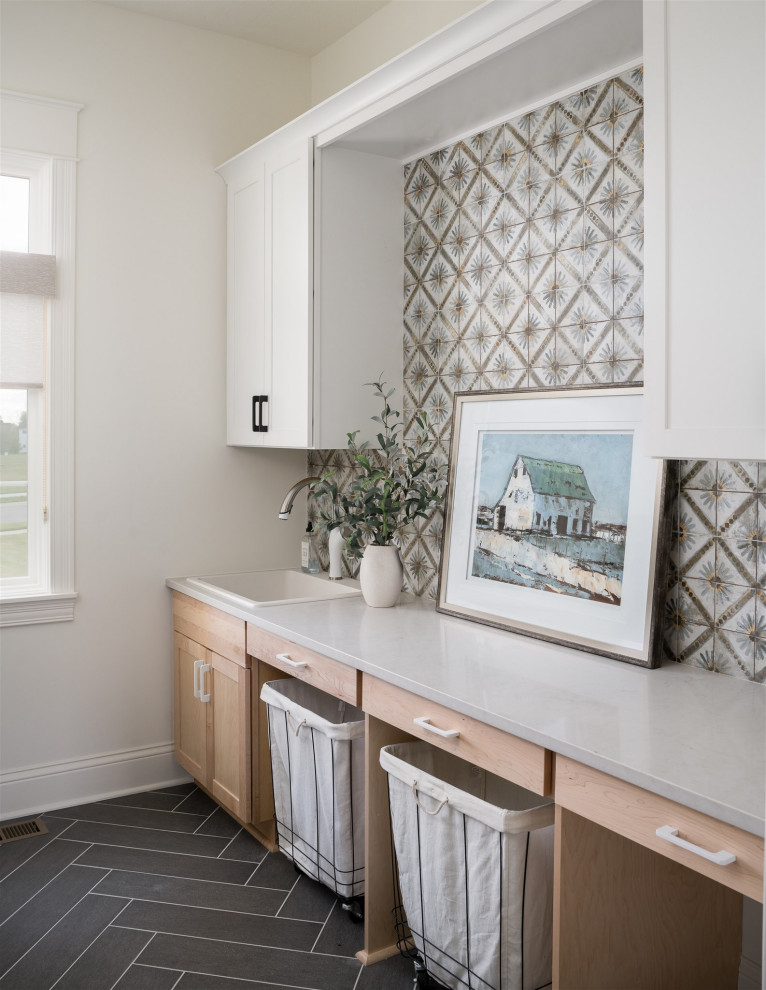 Example of a mid-sized beach style galley ceramic tile dedicated laundry room design in Indianapolis with an undermount sink, shaker cabinets, medium tone wood cabinets, mosaic tile backsplash and a side-by-side washer/dryer