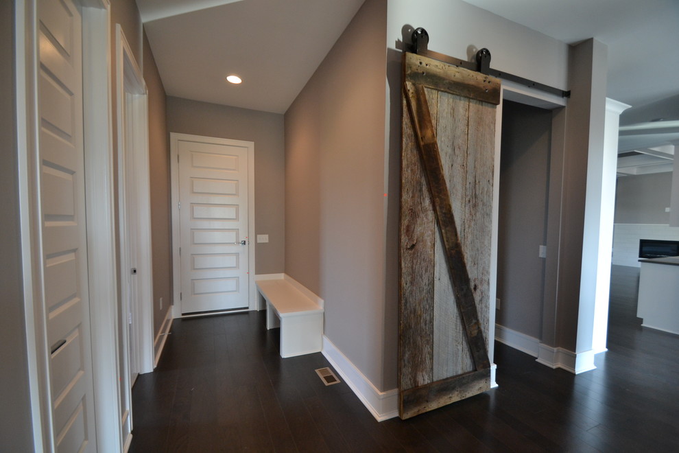 Design ideas for a large contemporary hallway in Indianapolis with grey walls and dark hardwood floors.
