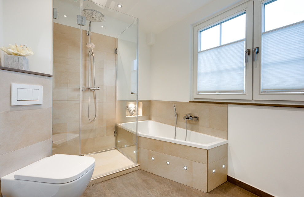 Design ideas for a large contemporary 3/4 bathroom in Hamburg with flat-panel cabinets, white cabinets, a corner tub, a corner shower, a wall-mount toilet, beige tile, ceramic tile, white walls, light hardwood floors, a drop-in sink, solid surface benchtops, beige floor and a hinged shower door.