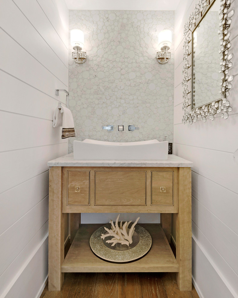 Photo of a beach style powder room in Miami with a vessel sink, furniture-like cabinets, white tile, white walls, dark hardwood floors and light wood cabinets.
