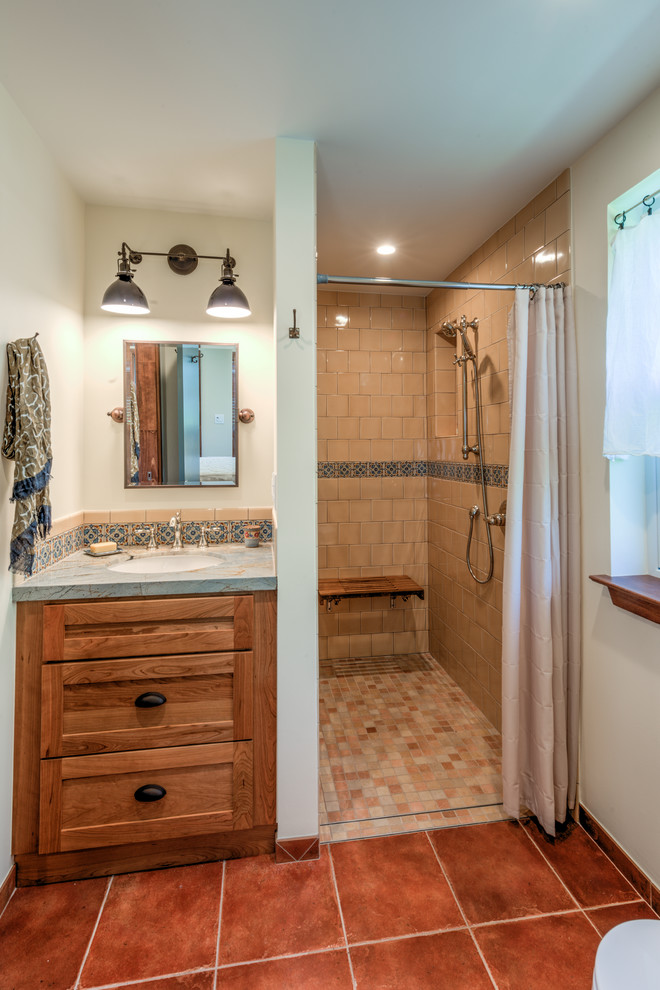 Photo of a small transitional master bathroom in San Francisco with shaker cabinets, medium wood cabinets, quartzite benchtops, a curbless shower, beige tile, ceramic tile, an undermount sink, a shower curtain and multi-coloured benchtops.