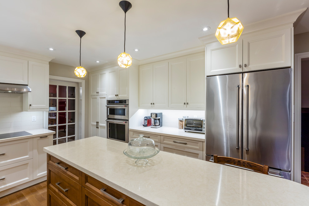 Example of a transitional kitchen design in Toronto