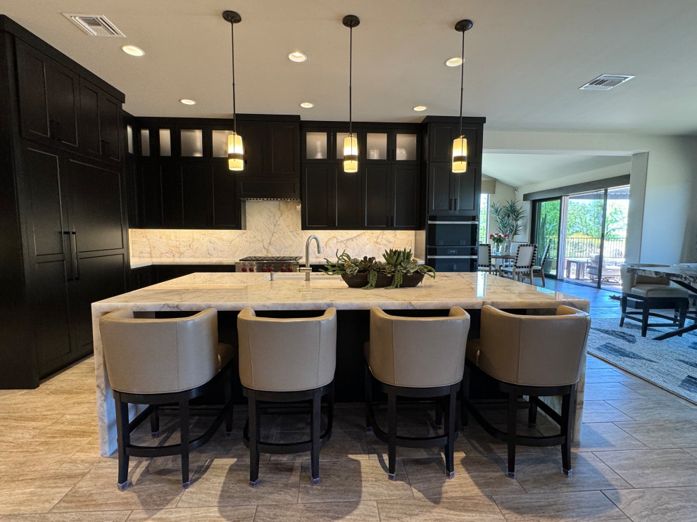 Inspiration for a large transitional l-shaped porcelain tile and beige floor kitchen pantry remodel in Phoenix with an undermount sink, shaker cabinets, dark wood cabinets, quartzite countertops, beige backsplash, stone slab backsplash, paneled appliances, an island and beige countertops