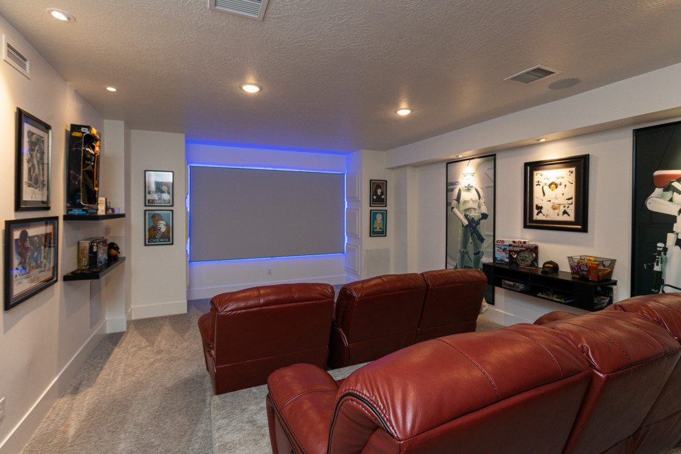 Inspiration for a large modern enclosed home theatre in Salt Lake City with white walls, vinyl floors, a projector screen and brown floor.