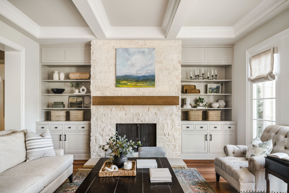 Inspiration for a mid-sized transitional enclosed living room in Charlotte with beige walls, medium hardwood floors, a standard fireplace, a stone fireplace surround, no tv, coffered and brown floor.
