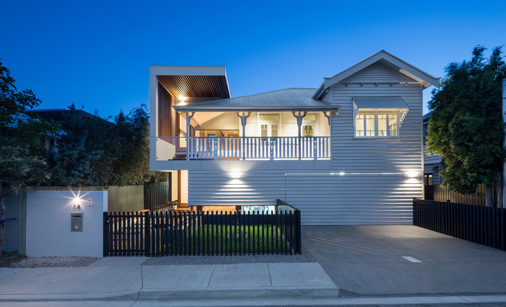 Mid-sized transitional two-storey white exterior in Brisbane.