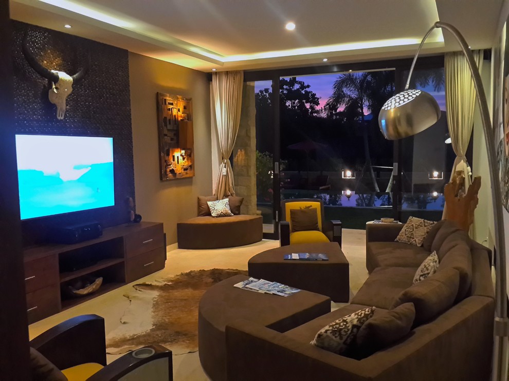Photo of a large asian enclosed home theatre with brown walls, limestone floors and a wall-mounted tv.