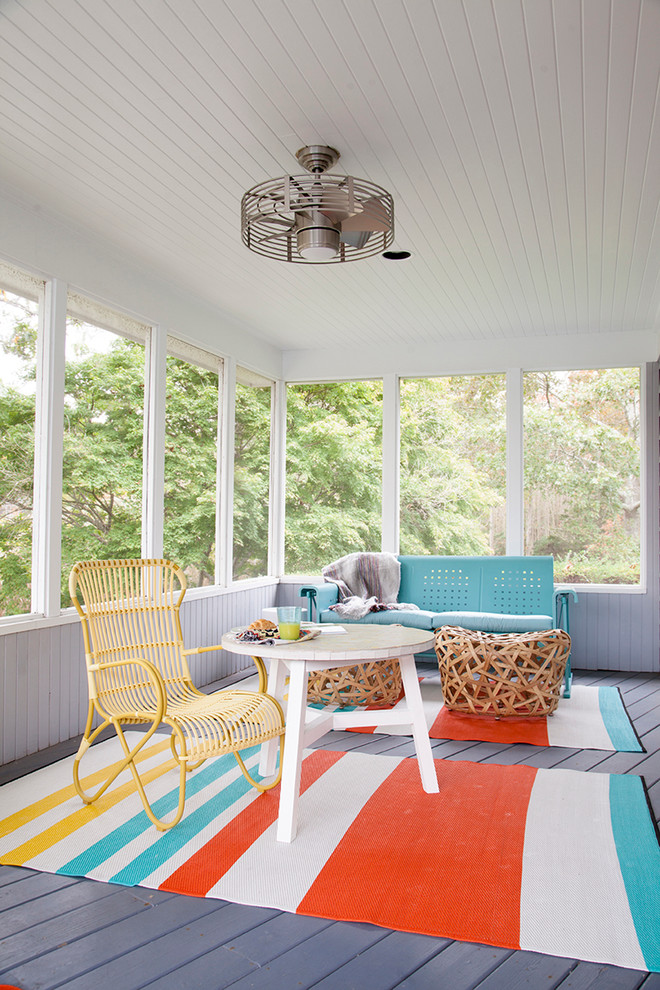 Inspiration for an eclectic sunroom in New York with grey floor.