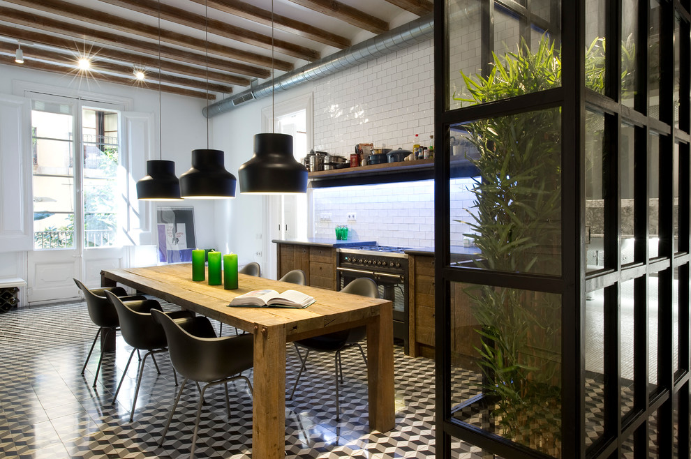 This is an example of a mid-sized industrial single-wall eat-in kitchen in Barcelona with medium wood cabinets, white splashback, ceramic floors, no island, open cabinets and subway tile splashback.