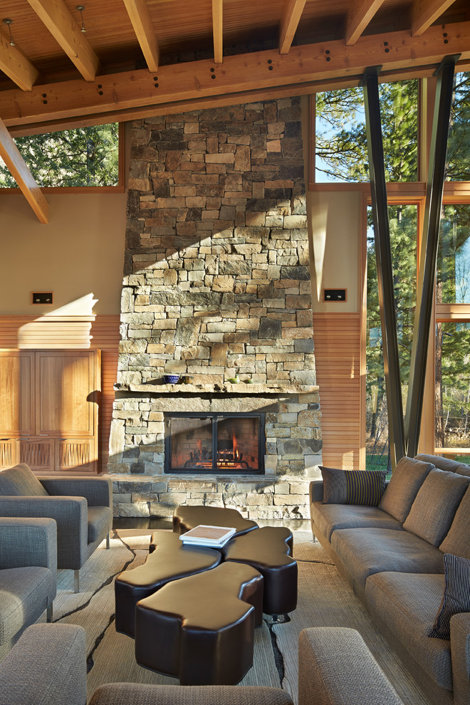 Inspiration for a large contemporary open concept living room in Seattle with a standard fireplace, a stone fireplace surround and no tv.