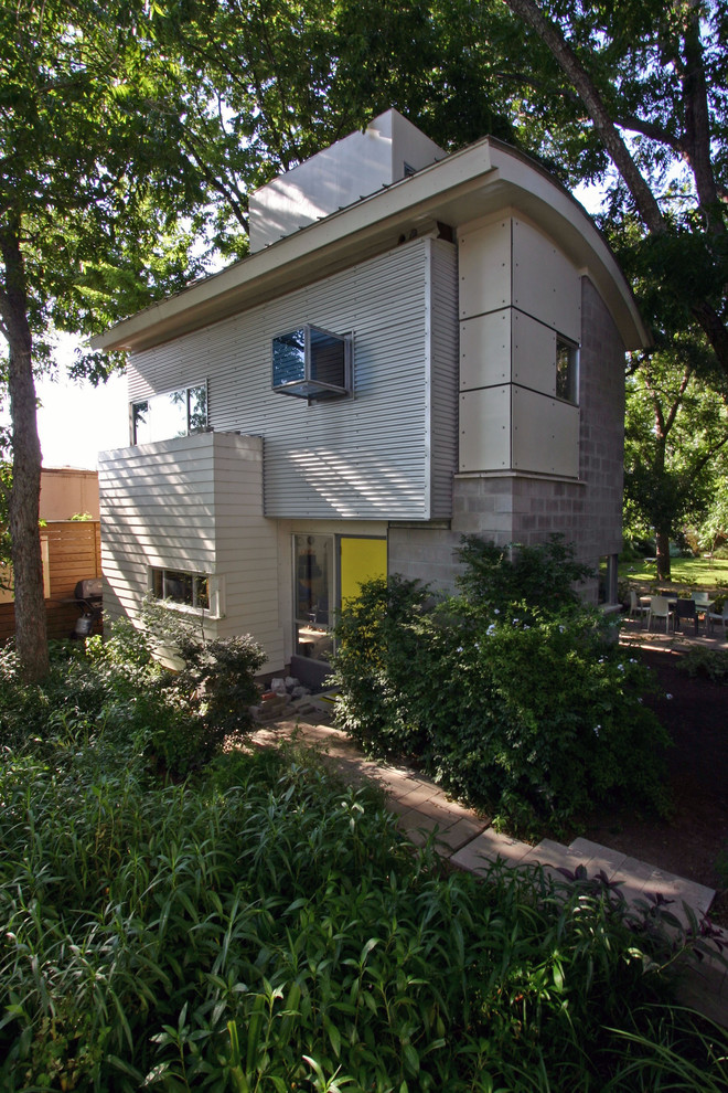 Photo of a small contemporary exterior in Houston with mixed siding.