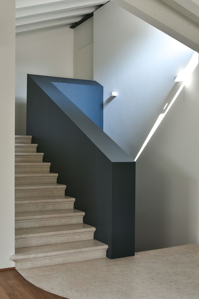 Inspiration for a mid-sized contemporary u-shaped staircase in Venice.