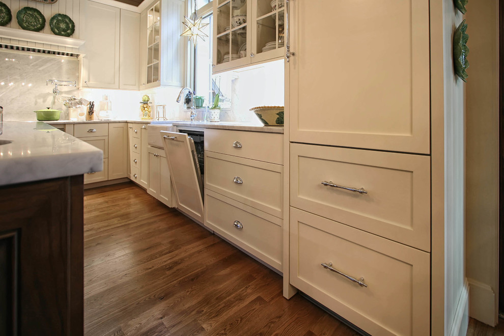 Inspiration for a transitional eat-in kitchen in Charlotte with a farmhouse sink, flat-panel cabinets, white cabinets, marble benchtops, panelled appliances and with island.