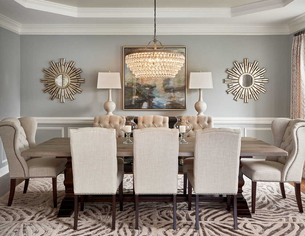 Transitional dining room in Charlotte with grey walls and a standard fireplace.