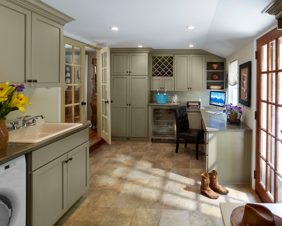 Expansive traditional utility room in Philadelphia with an utility sink, green cabinets, quartz benchtops, beige walls, terra-cotta floors and a side-by-side washer and dryer.