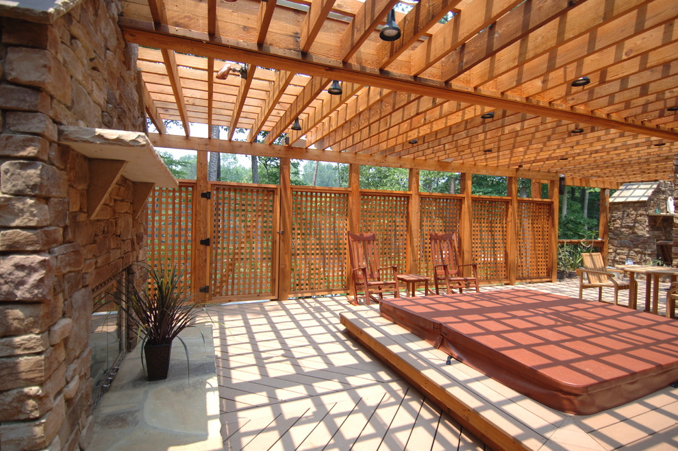 Outdoor kitchen deck - huge rustic backyard outdoor kitchen deck idea in Atlanta with a pergola