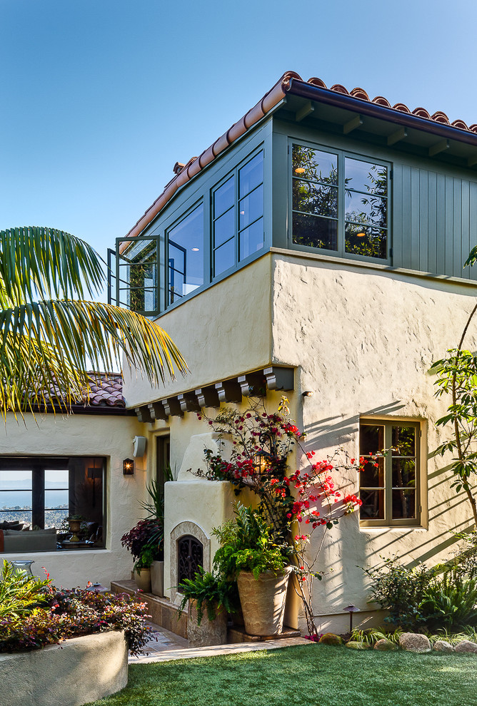 This is an example of a mediterranean two-storey beige exterior in Santa Barbara.