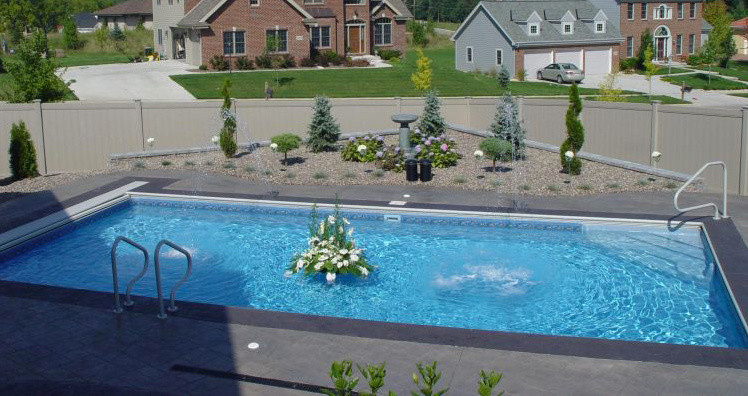 Example of a backyard rectangular pool fountain design