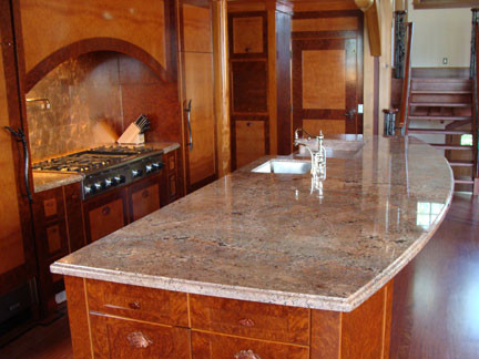 Kitchen - medium tone wood floor kitchen idea in Calgary with medium tone wood cabinets and granite countertops