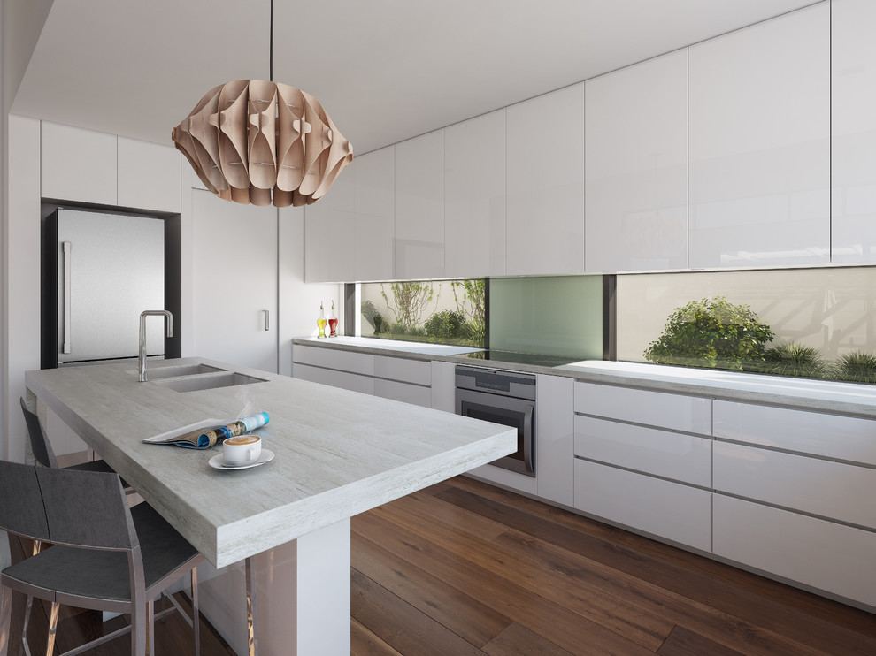 This is an example of a large contemporary l-shaped eat-in kitchen in Melbourne with an undermount sink, flat-panel cabinets, white cabinets, quartz benchtops, stainless steel appliances, medium hardwood floors and with island.
