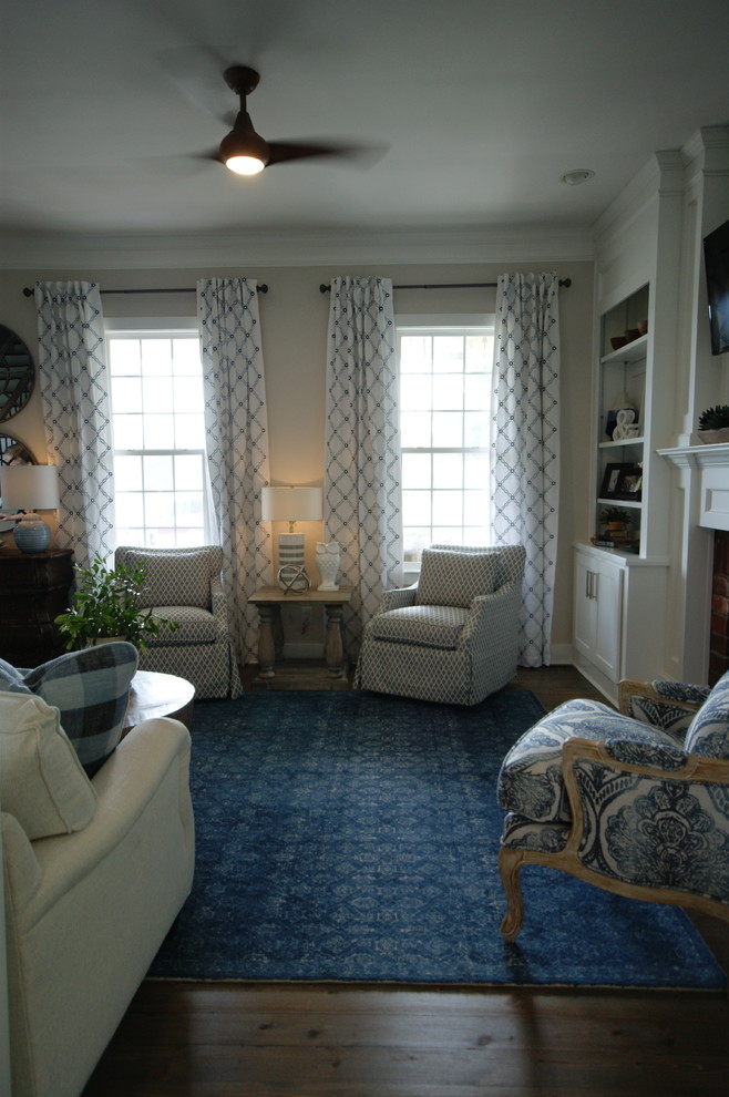 This is an example of a transitional family room in Atlanta.