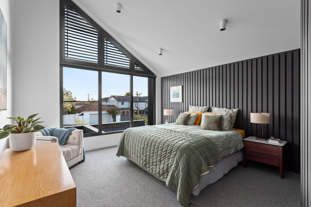 Design ideas for a mid-sized contemporary master bedroom in Melbourne with carpet, grey floor, vaulted, grey walls and planked wall panelling.