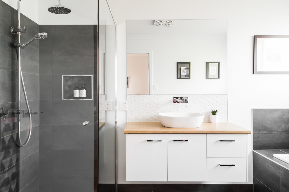 Photo of a contemporary bathroom in Hobart with flat-panel cabinets, white cabinets, white walls, a vessel sink, wood benchtops and beige benchtops.