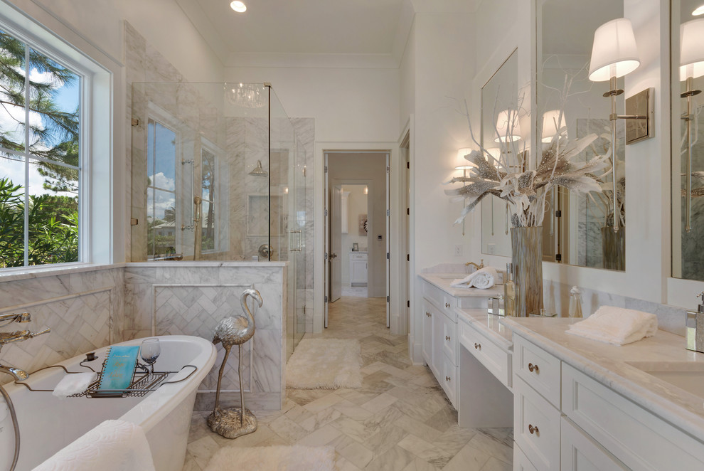 This is an example of a large country bathroom in Other with recessed-panel cabinets, white cabinets, a freestanding tub, a one-piece toilet, multi-coloured tile, mosaic tile, white walls, marble floors, an undermount sink, marble benchtops and with a sauna.