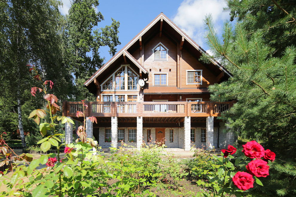 Large mountain style home design photo in Moscow