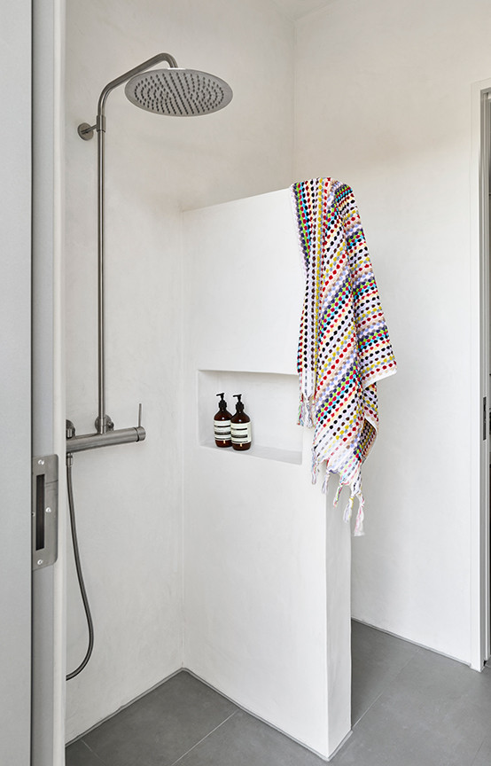 Design ideas for a mid-sized contemporary master bathroom in Brisbane with furniture-like cabinets, brown cabinets, an open shower, a one-piece toilet, blue tile, ceramic tile, porcelain floors, a drop-in sink, tile benchtops, grey floor, an open shower, a niche, a single vanity and a floating vanity.