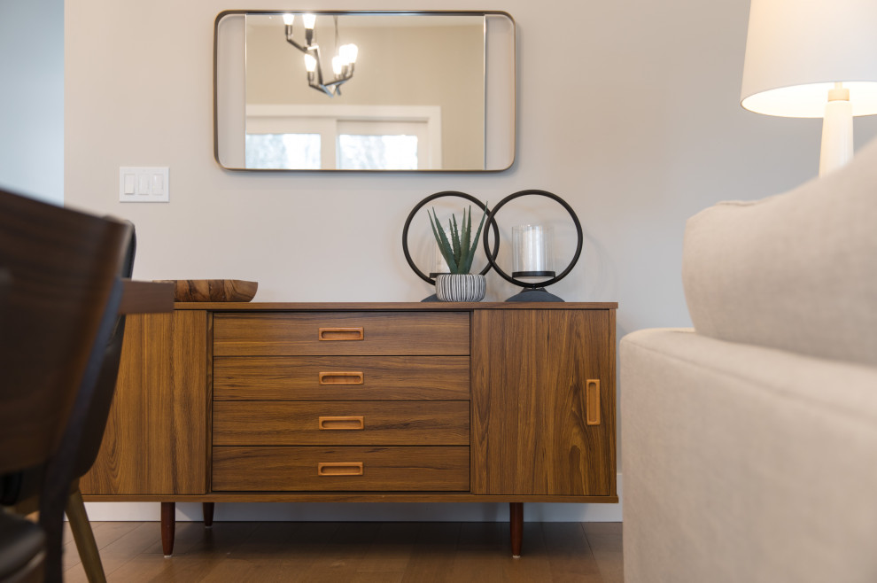 Inspiration for a mid-sized transitional light wood floor and brown floor great room remodel in Calgary with no fireplace