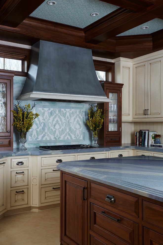 Photo of a traditional u-shaped open plan kitchen in Minneapolis with granite benchtops, blue splashback, stainless steel appliances, marble floors, with island, beaded inset cabinets, distressed cabinets, ceramic splashback and beige floor.