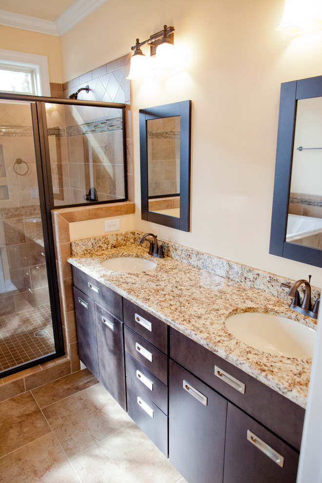 Design ideas for a large bathroom in Raleigh with a drop-in sink, flat-panel cabinets, granite benchtops, a corner tub, a corner shower, a two-piece toilet, beige tile and medium hardwood floors.