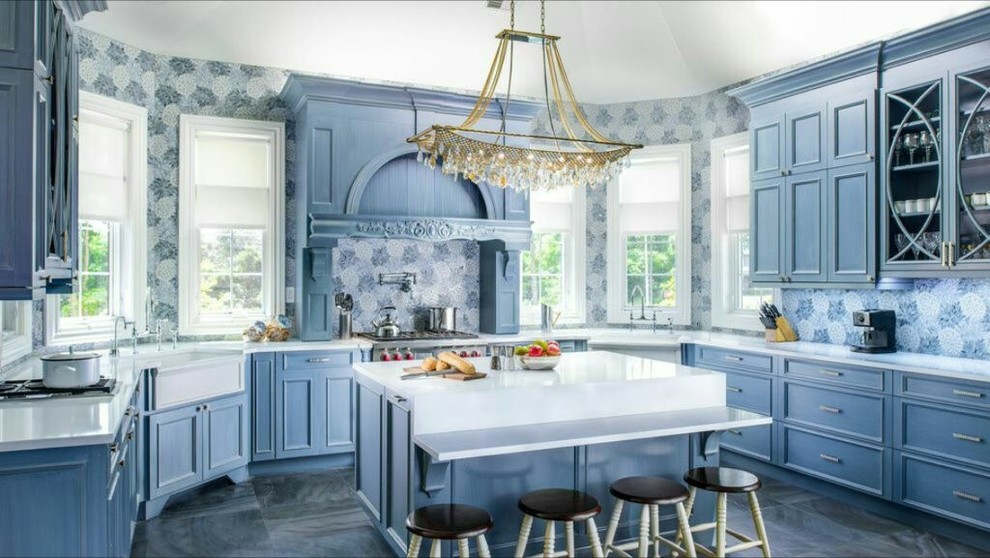Large transitional u-shaped kitchen photo in New York with a farmhouse sink, recessed-panel cabinets, gray cabinets and an island