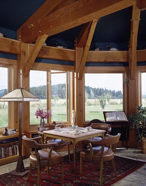 Example of a small mountain style great room design with blue walls and no fireplace
